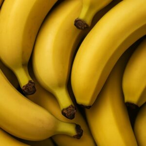 A vibrant collection of ripe bananas with a focus on texture and color, perfect for healthy food concepts.